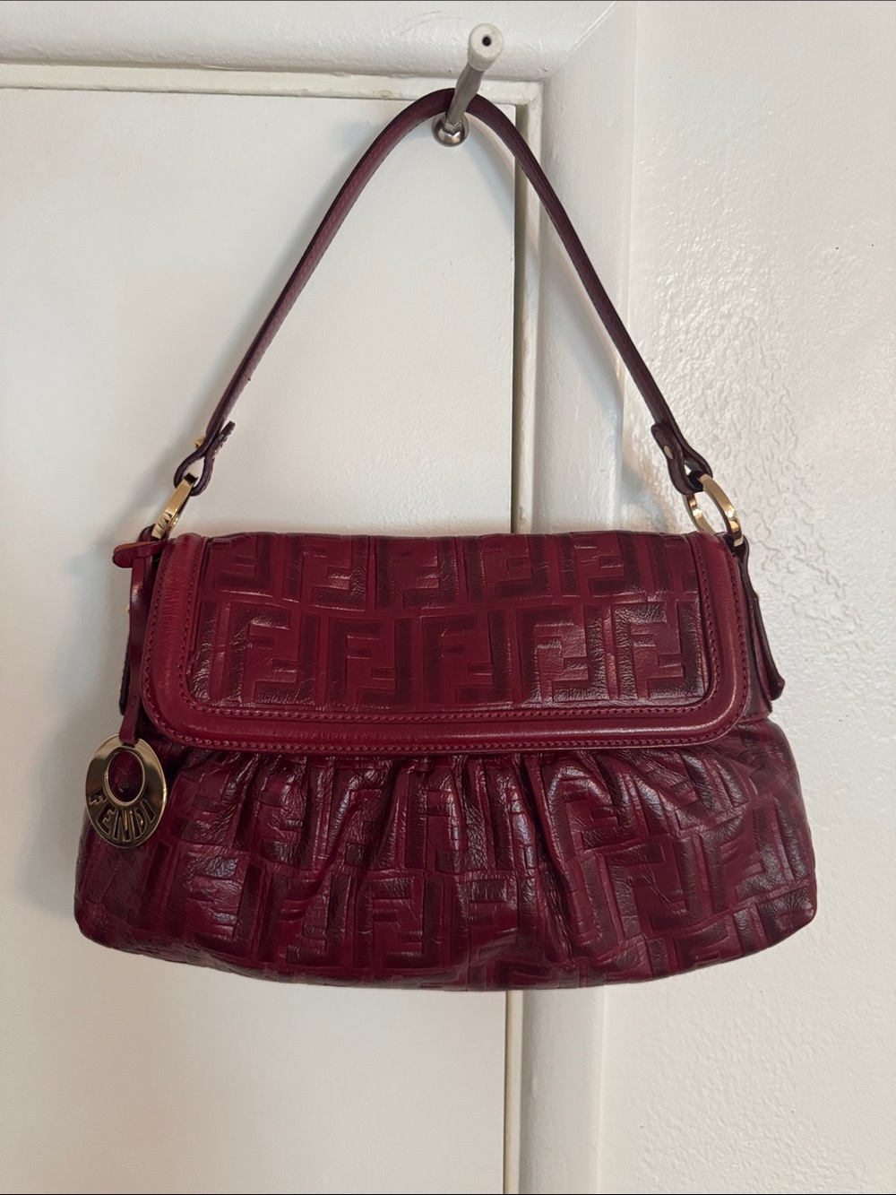 Authentic Fendi Wine Red Embossed FF Leather Shoulder Bag